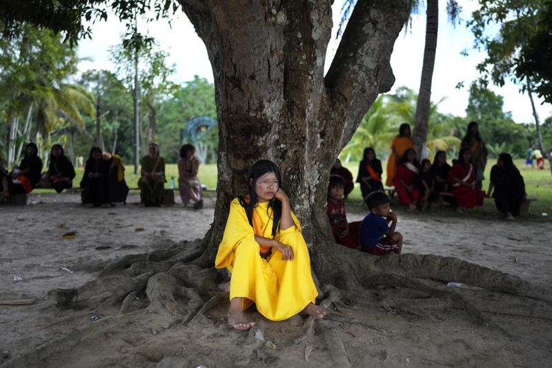 Ashaninka Sorita Shen attends a soccer match in the Apiwtxa village, Acre state, Brazil, Saturday, June 22, 2024. (AP Photo/Jorge Saenz)