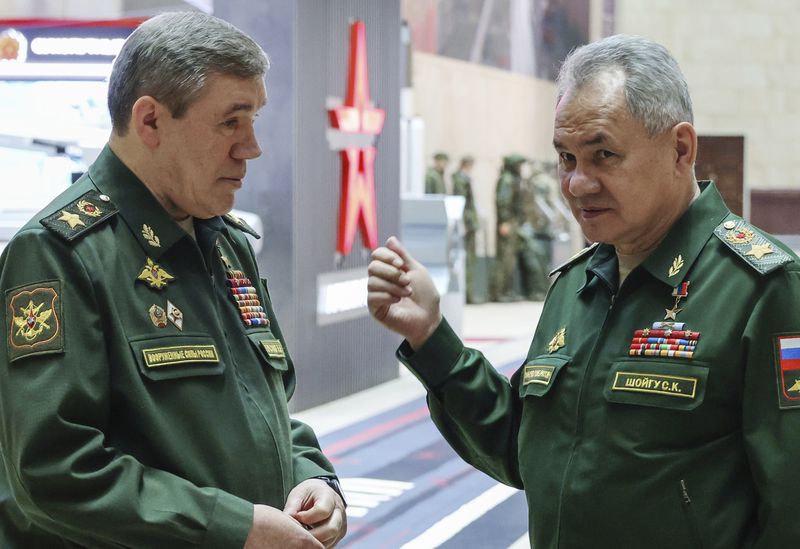 FILE - Russian Defense Minister Sergei Shoigu, right, gestures as he speaks to Russian Chief of General Staff Gen. Valery Gerasimov prior to a meeting Russian President Vladimir Putin with the top military brass in Moscow, Russia, Tuesday, Dec. 19, 2023. The International Criminal Court issued arrest warrants Tuesday for Russia’s former defense minister and its military chief of staff for attacking civilian targets in Ukraine.(Sputnik, Kremlin Pool Photo via AP, File)