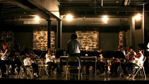 Local students participate in one of Atlanta Music Project's first orchestra concerts in 2011.