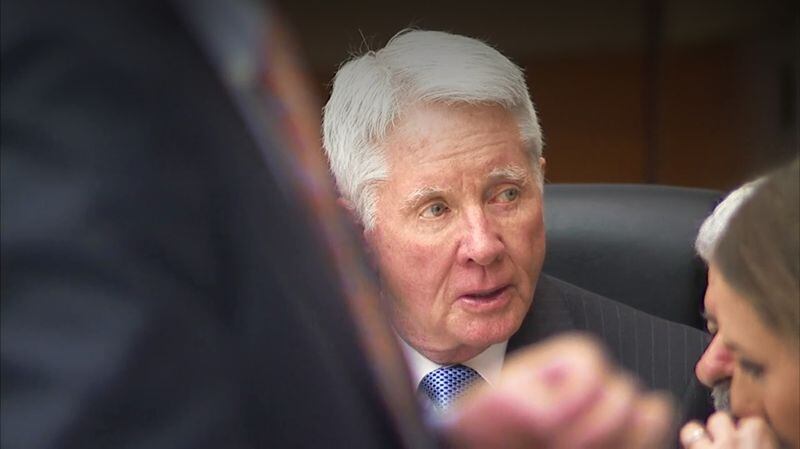 Tex McIver talks with his attorneys before the start of the day's testimony in his murder trial on March 20, 2018 at the Fulton Country Courthouse. (Channel 2 Action News)