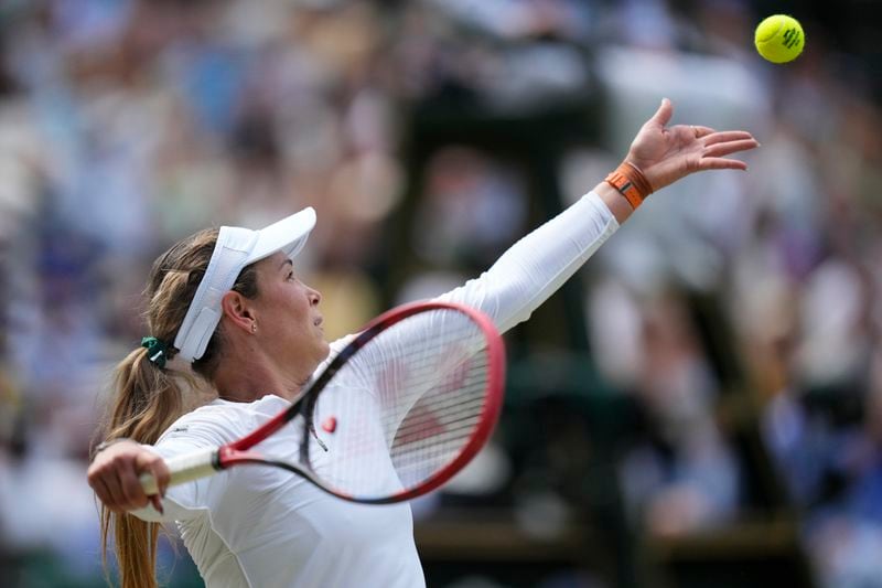 Donna Vekic of Croatia serves to Jasmine Paolini of Italy during their semifinal match at the Wimbledon tennis championships in London, Thursday, July 11, 2024. (AP Photo/Mosa'ab Elshamy)