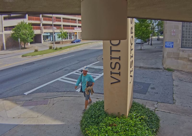  A man identified as a suspect in a May 24 killing is seen walking around Macon.