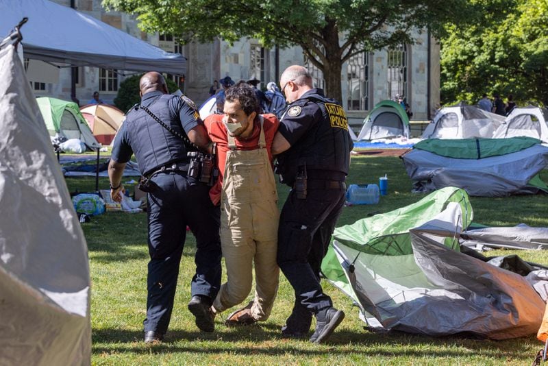 Police arrest pro-Palestinian protesters at an encampment at the Emory campus in Atlanta on Thursday, April 25, 2024. (Arvin Temkar / AJC)