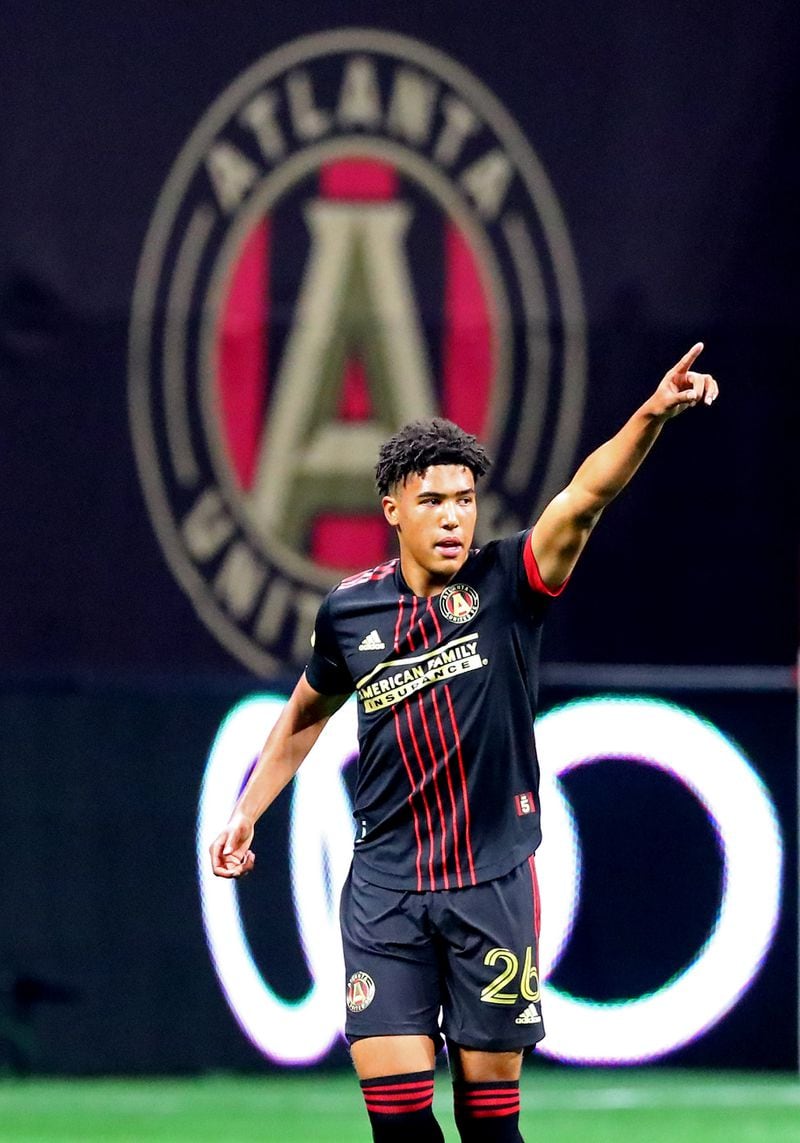 Atlanta United's Caleb Wiley reacts after scoring his first career goal with a kick past Sporting KC goalkeeper Tim Melia for a 3-1 lead and victory in an MLS soccer match Sunday in Atlanta. (Curtis Compton / Curtis.Compton@ajc.com)