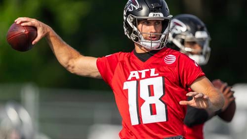 Atlanta Falcons quarterback Kirk Cousins (18) throws a pass during an NFL training camp football practice, Saturday, July 27, 2024, in Buford, Ga. (AP Photo/Jason Allen)