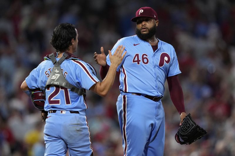 Philadelphia Phillies' José Alvarado celebrates with Garrett Stubbs after the Phillies won a baseball game against the Los Angeles Dodgers, Thursday, July 11, 2024, in Philadelphia. (AP Photo/Matt Slocum)