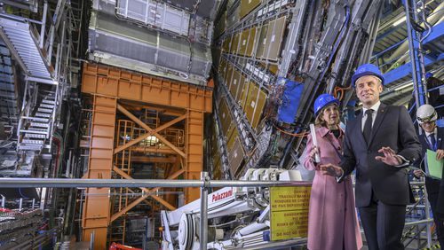 FILE - Fabiola Gianotti, left, Director General of the European Organization for Nuclear Research (CERN), and French President Emmanuel Macron, front, visit the ATLAS experiment, at the CERN (the European particle physics laboratory), in Meyrin near Geneva, Switzerland, Thursday, Nov. 16, 2023. (Martial Trezzini/Keystone via AP, Pool, File)