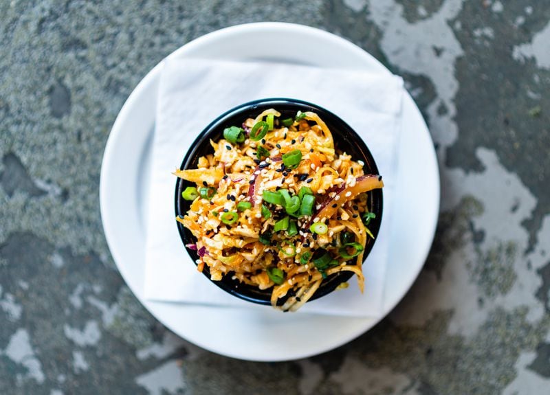 Sweet Auburn Barbecue’s green papaya slaw uses Southeast Asian flavors to balance the richness of barbecue. CONTRIBUTED BY HENRI HOLLIS