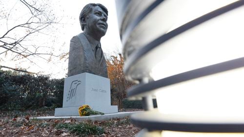 A bouquet is seen at the bust of Jimmy Carter outside of the Carter Center on Sunday, November 19, 2023, after the death of Rosalynn Carter, the wife of former president Jimmy Carter.
Miguel Martinez /miguel.martinezjimenez@ajc.com