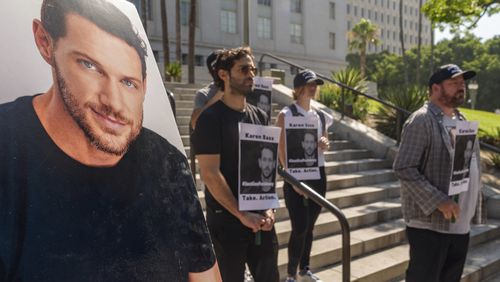 Friends and supporters of late actor Johnny Wactor, pictured left, hold a news conference to demand justice for the former "General Hospital" actor during a news conference outside Los Angeles City Hall in Los Angeles Tuesday, Aug.13, 2024. (AP Photo/Damian Dovarganes)