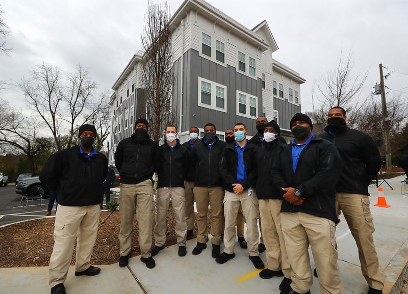 The recently recruited APD class 274 arrive for the ribbon cutting of Unity Place, an apartment complex for Atlanta police recruits in the English Avenue neighborhood. (Curtis Compton / Curtis.Compton@ajc.com)