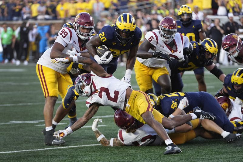 Michigan running back Kalel Mullings (20) runs against Southern California in the second half of an NCAA college football game in Ann Arbor, Mich., Saturday, Sept. 21, 2024. (AP Photo/Paul Sancya)