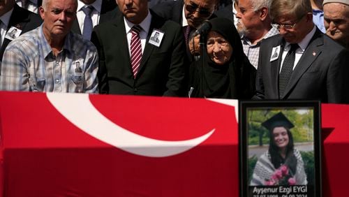 Mehmet, the father of Aysenur Ezgi Eygi, a 26 year-old Turkish-American activist killed by the Israeli military, left, attends prayers during his daughter's funeral outside the central mosque of Didim, Turkey, Saturday, Sept. 14, 2024,(AP Photo/Khalil Hamra)