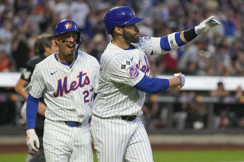 New York Mets' J.D. Martinez, right, celebrates his two-run homer with Mark Vientos during the first inning of a baseball game against the Baltimore Orioles at Citi Field, Monday, Aug. 19, 2024, in New York. (AP Photo/Seth Wenig)