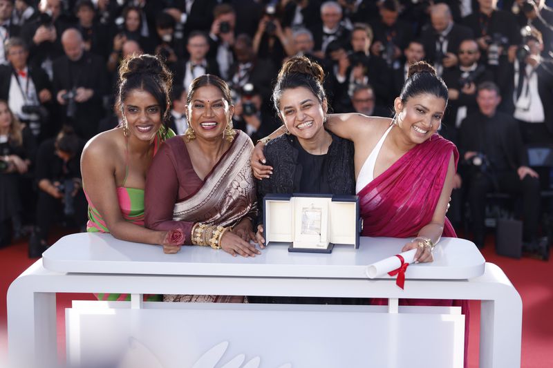 Payal Kapadia, second from right, winner of the grand prize for 'All We Imagine as Light,' poses with Kani Kusruti, from left, Chhaya Kadam, and Divya Prabha during the photo call following the awards ceremony at the 77th international film festival, Cannes, southern France, Saturday, May 25, 2024. (Photo by Vianney Le Caer/Invision/AP)