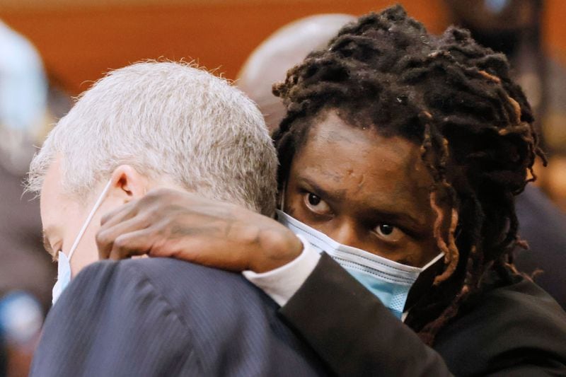 Young Thug, whose real name is Jeffery Williams, speaks to his lawyer Brian Steel during the Jury selection portion of the trial at Fulton County courtroom on Monday, Feb 6, 2023. Miguel Martinez / miguel.martinezjimenez@ajc.com