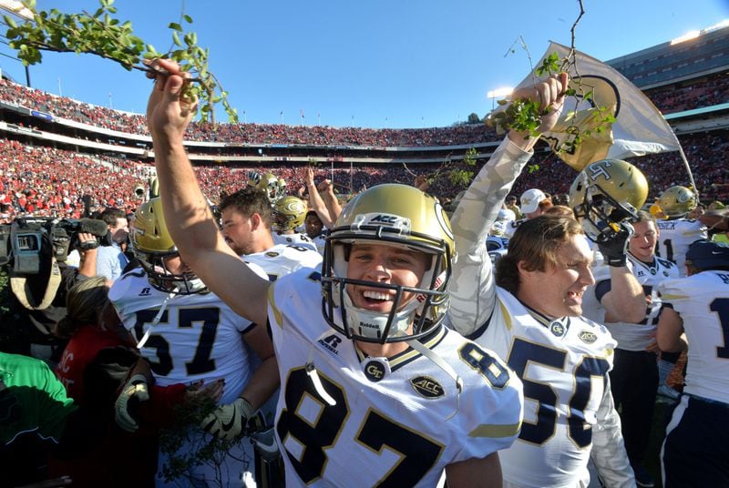 November 26, 2016 Athens - Georgia Tech place kicker Harrison Butker (87) and other players celebrate their 28-27 win over Georgia with a piece of the Sanford Stadium hedges at Sanford Stadium on Saturday, November 26, 2016. HYOSUB SHIN / HSHIN@AJC.COM