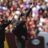 Washington Commmanders head coach Dan Quinn reacts to a play during the first half of an NFL football game against the New York Giants in Landover, Md., Sunday, Sept. 15, 2024. (AP Photo/Steve Ruark)