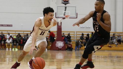 Morehouse guard Michael Olmert (11) drives to the basket while being defended by a Clark Atlanta player during a college basketball game, Saturday, Feb. 9, 2019, in Atlanta.  BRANDEN CAMP/SPECIAL