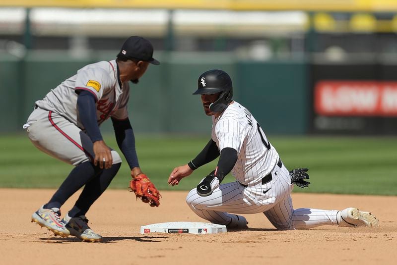 Chicago White Sox's Danny Mendick steals second base during the third inning of a baseball game against the Chicago White Sox, Thursday, June 27, 2024, in Chicago. (AP Photo/Melissa Tamez)
