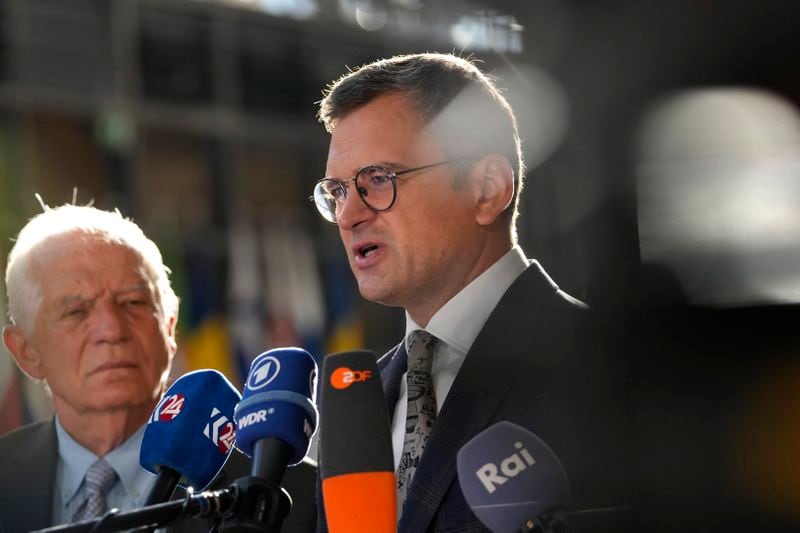 European Union foreign policy chief Josep Borrell, left, and Ukraine's Foreign Minister Dmytro Kuleba speak with the media as they arrive for a meeting of EU foreign ministers at the European Council building in Brussels, Thursday, Aug. 29, 2024. (AP Photo/Virginia Mayo)