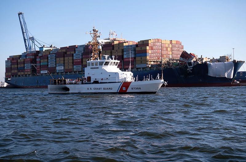 This image provided by the U.S. Coast Guard shows the U.S. Coast Guard Cutter Sailfish, an 87-foot Marine Protector class vessel, as it prepares to escort the Motor Vessel Dali during its transit from the Port of Baltimore to the Port of Virginia, Monday, June 24, 2024. (Petty Officer 3rd Class Christopher Bokum/U.S. Coast Guard via AP)