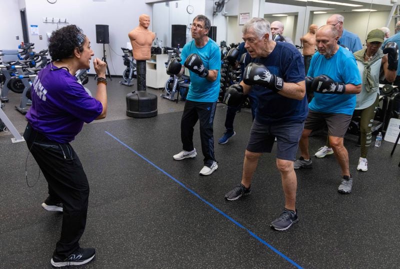 Nausheen Quraishy (left), a Rock Steady Boxing Instructor, runs a class in which people with Parkinson's exercise and try to regain their strength at the Kennestone Health Place at Kennestone Hospital in Kennesaw. After suffering an AVM rupture eighteen years ago, doctors said she had no reason to be alive and functioning. She uses her own personal battles to inspire others to fight for their future. PHIL SKINNER FOR THE ATLANTA JOURNAL-CONSTITUTION