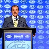 ACC commissioner Jim Phillips speaks during a news conference at the ACC media days, Monday, July 22, 2024, in Charlotte, N.C. (AP Photo/Matt Kelley)