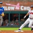 Atlanta Braves' Travis d'Arnaud, right, tags second base after a hit by Atlanta Braves catcher Sean Murphy while Kansas City Royals second baseman Michael Massey, left, waits for the throw to him in the fourth inning of a baseball game, Sunday, Sept. 29, 2024, in Atlanta. (AP Photo/Jason Allen)