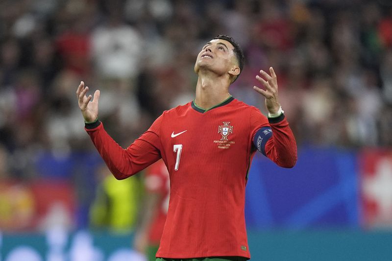 Portugal's Cristiano Ronaldo reacts after an attempt to score during a round of sixteen match between Portugal and Slovenia at the Euro 2024 soccer tournament in Frankfurt, Germany, Monday, July 1, 2024. (AP Photo/Matthias Schrader)
