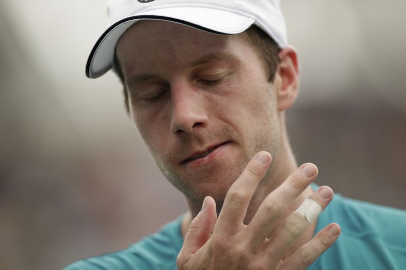 Botic van De Zandschulp, of the Netherlands, reacts after losing to Jack Draper, of Great Britain, during the third round of the U.S. Open tennis championships, Saturday, Aug. 31, in New York. 2024. (AP Photo/Adam Hunger)