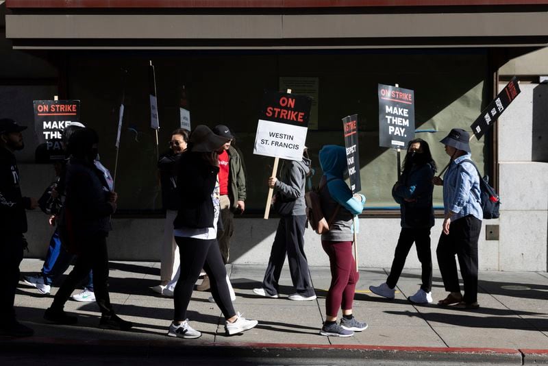 Hotel workers picket outside the Westin St. Francis Monday, Sept. 2, 2024, in San Francisco. (AP Photo/Benjamin Fanjoy)