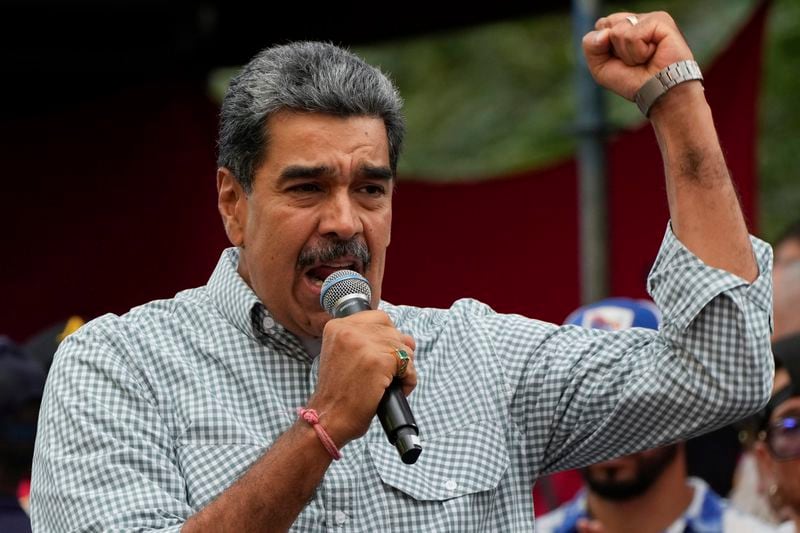 FILE - Venezuela's President Nicolas Maduro addresses government loyalists gathered at the presidential palace in support of his reelection one month after the presidential vote, in Caracas, Venezuela, Aug. 28, 2024. (AP Photo/Ariana Cubillos, File)