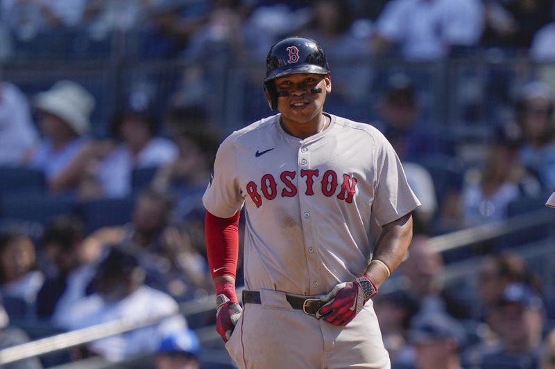 Boston Red Sox's Rafael Devers smiles after hitting a two-run single during the fifth inning of a baseball game against the New York Yankees, Saturday, Sept. 14, 2024, in New York. (AP Photo/Frank Franklin II)