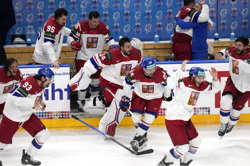 Members of the Czech Republic team celebrates after they defeated Switzerland 2-0 in a gold medal match at the Ice Hockey World Championships in Prague, Czech Republic, Sunday, May 26, 2024. (AP Photo/Darko Vojinovic)