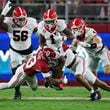 Georgia running back Trevor Etienne (1) is tackled by Alabama defensive back Malachi Moore (13) during the second quarter at Bryant-Denny Stadium, Saturday, Sept. 28, 2024, in Tuscaloosa, Al. (Jason Getz / AJC)

