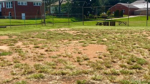 This is the planned site for a future track and field venue at Legacy Park (once the United Methodist Children's Home), with the old gym in the background and a former 1930s-era school building to the left. The facility, however, could still be another decade in the future. Bill Banks file photo for the AJC