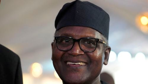 FILE - Aliko Dangote, Africa's wealthiest man, smiles during the opening ceremony of Africa's biggest oil refinery in Lagos, Nigeria, Monday, May 22, 2023. Nigerian legislators on Monday, July 22, 2024, began a probe into the allegations of the importation of contaminated fuel into the country, as part of moves to resolve wider issues causing a rift between an oil refinery owned by Dangote and the industry regulator. (AP Photo/Sunday Alamba, File)