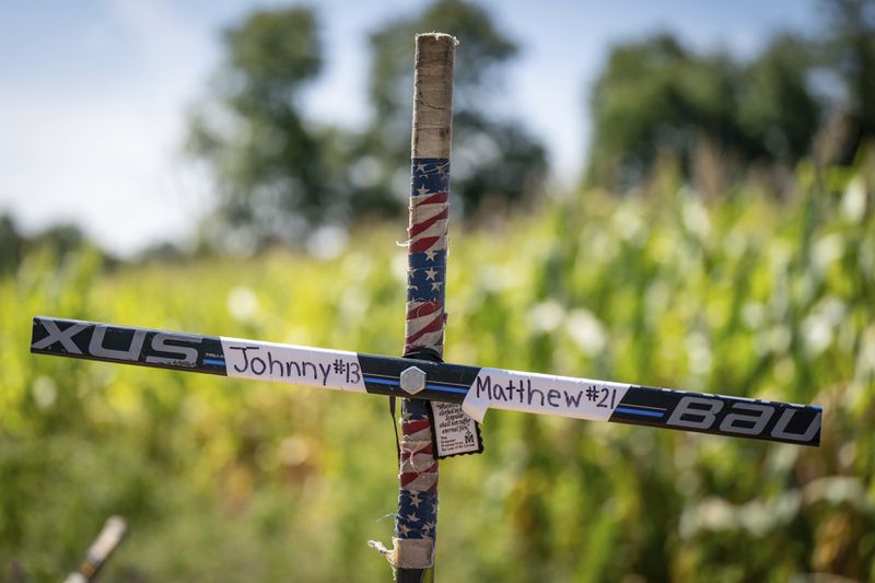 A memorial for Johnny and Matthew Gaudreau, who died last week when they were struck by a suspected drunken driver while riding bicycles, is shown in Salem County, N.J, Wednesday, Sept. 4, 2024.(Jessica Griffin/The Philadelphia Inquirer via AP)