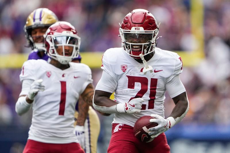 Washington State running back Wayshawn Parker (21) reacts to making a catch against Washington during the first half of an NCAA college football game Saturday, Sept. 14, 2024, in Seattle. (AP Photo/Lindsey Wasson)