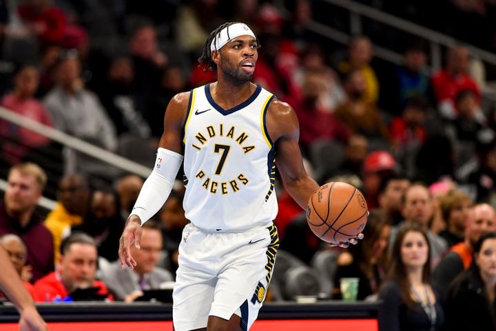 Indiana Pacers guard Buddy Hield (7) brings the ball up court against the Atlanta Hawks during the first half of an NBA game Tuesday, November 21, 2023. (Daniel Varnado/For the AJC)