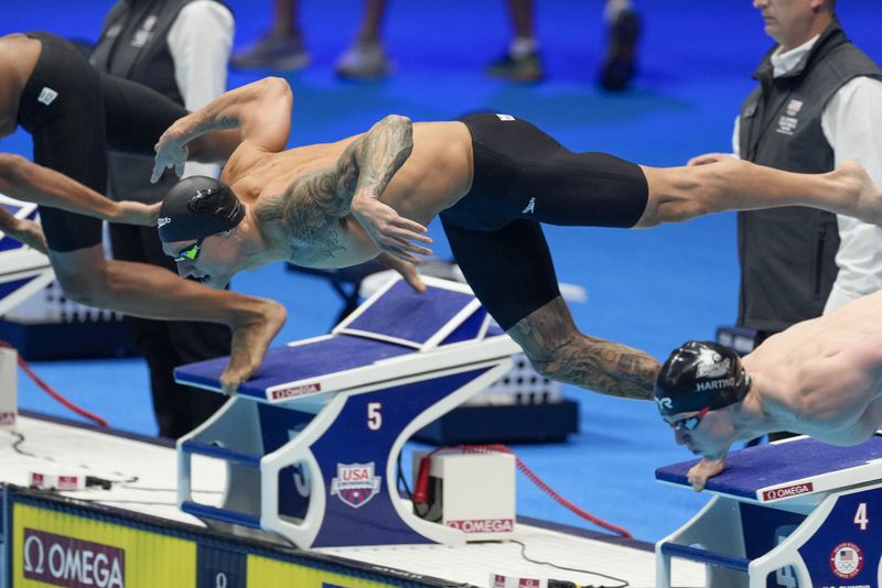 Caeleb Dressel swims during the Men's 100 butterfly finals Saturday, June 22, 2024, at the US Swimming Olympic Trials in Indianapolis. (AP Photo/Darron Cummings)