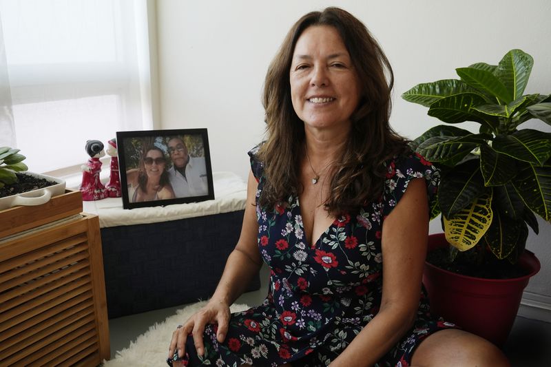 Maria Zambrano sits at her apartment, Monday, Aug. 12, 2024, in Bal Harbour, Fla. (AP Photo/Marta Lavandier)