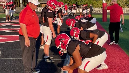 Allatoona's linemen go through their warm-ups before their Region 7-4A game against Dalton on Sept. 20, 2024, at Allatoona High School.