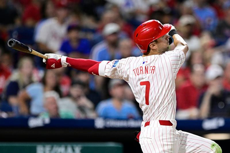 Philadelphia Phillies' Trea Turner watches his solo home run off Atlanta Braves' Max Fried during the sixth inning of a baseball game, Saturday, Aug. 31, 2024, in Philadelphia. (AP Photo/Derik Hamilton)