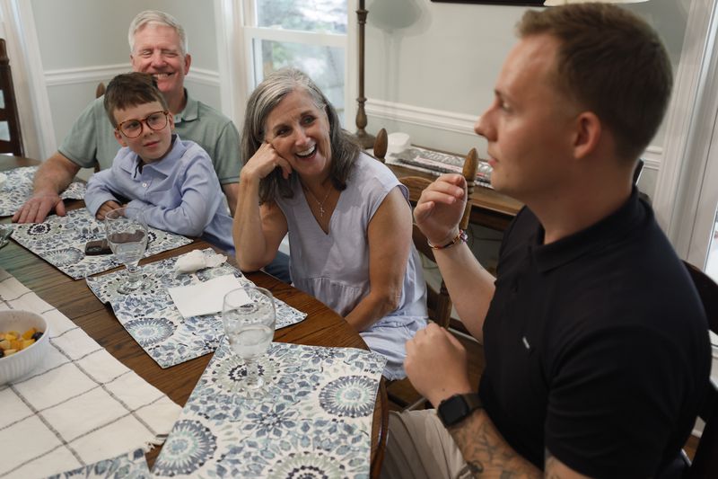 Steve and Dale Tingle listen to stories from Kevin Krüger during brunch on a Sunday afternoon at their house in Watkinsville, near Athens. This was Krüger’s third visit from Germany to the Tingles, whom he now considers family after Dale Tingle donated stem cells, saving his life. (Miguel Martinez/AJC)