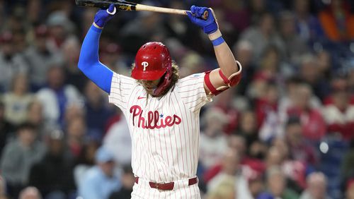 Philadelphia Phillies' Alec Bohm reacts after striking out against Chicago Cubs pitcher Hayden Wesneski during the eighth inning of a baseball game, Tuesday, Sept. 24, 2024, in Philadelphia. (AP Photo/Matt Slocum)