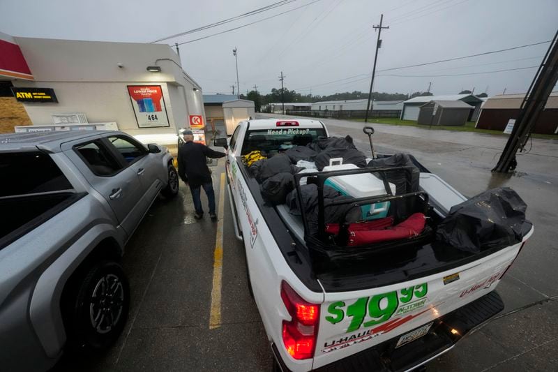 Pat Simon, a resident of Morgan City, stops at a gas station after loading up a rental truck with possessions from his home, as he evacuates to a hotel in anticipation of Tropical Storm Francine, in Morgan City, La., Wednesday, Sept. 11, 2024. (AP Photo/Gerald Herbert)