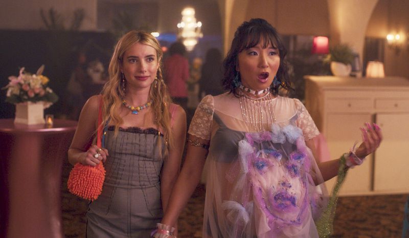 This image released by Amazon shows Emma Roberts, left, and Poppy Liu in a scene from "Space Cadet." (Prime Video via AP)