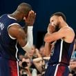 FILE - United States' Stephen Curry (4) and LeBron James (6) celebrate after beating France to win the gold medal during a men's gold medal basketball game at Bercy Arena at the 2024 Summer Olympics, Aug. 10, 2024, in Paris, France. (AP Photo/Mark J. Terrill, File)